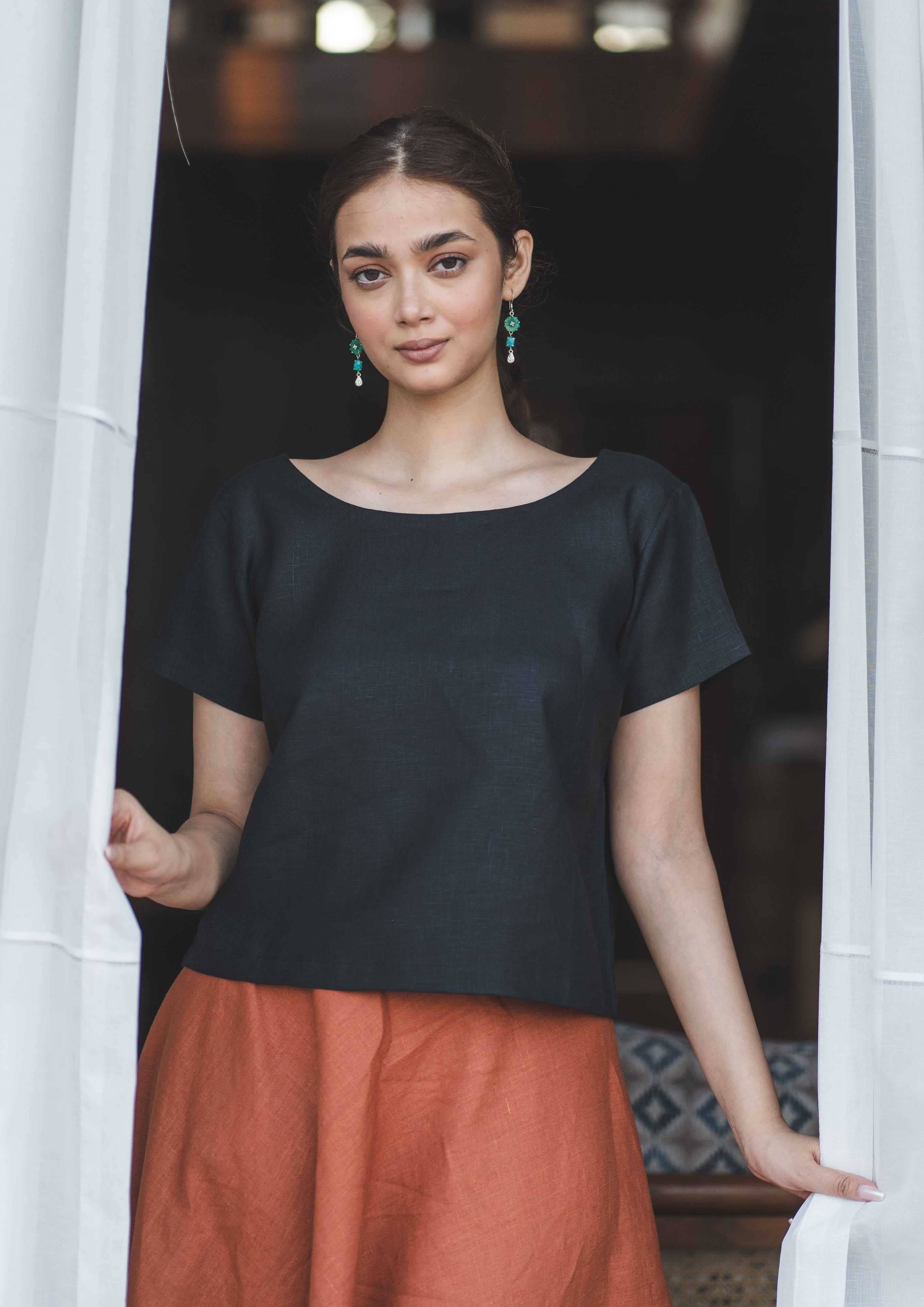 Black linen crop top and rust skirt